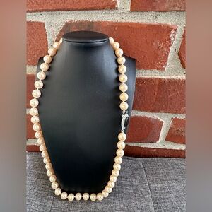 Vintage peach pearl necklace with a decorative clasp necklace